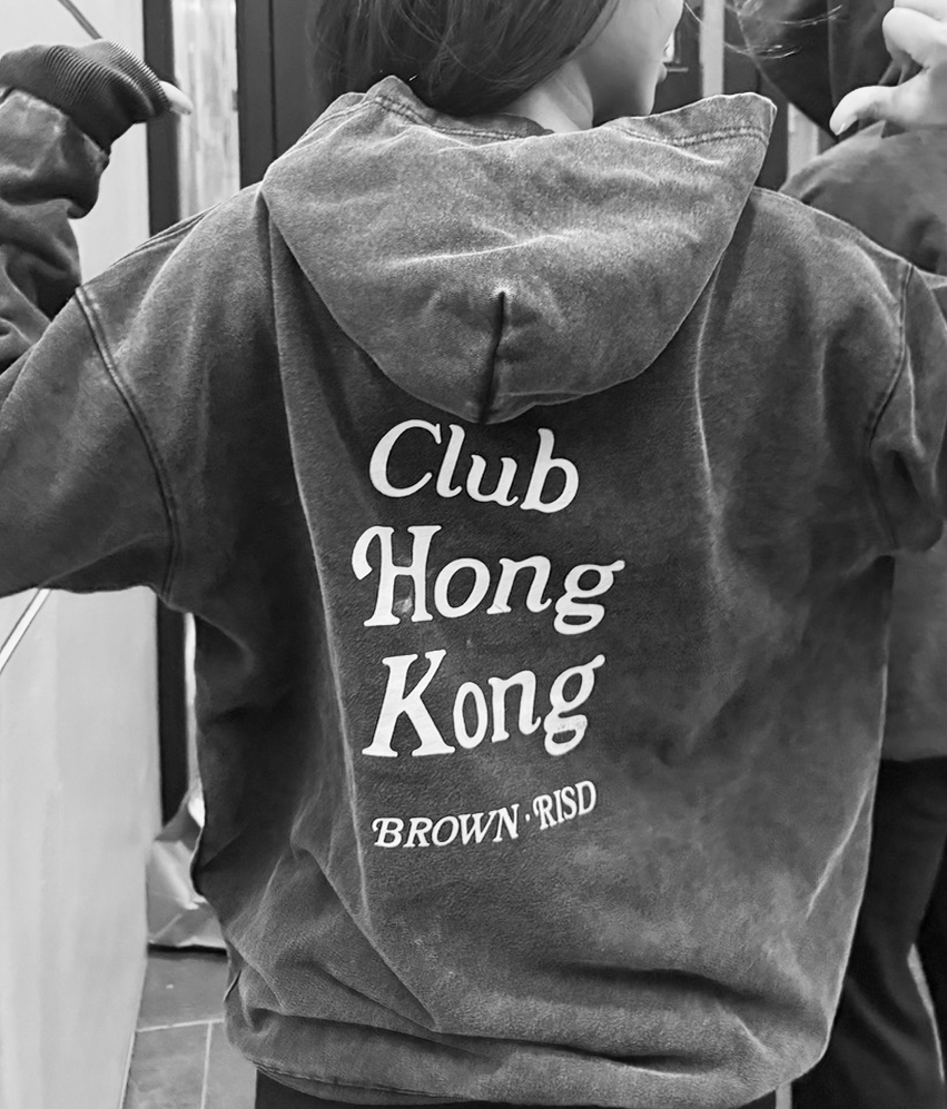 Club Hong Kong hoodie worn in a black-and-white mirror photograph